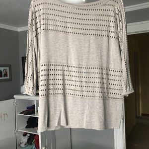 Light gray, mid length sleeve shirt.